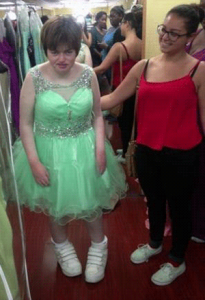 Siobhan and Lauren, Siobhan in a pale green dress with a sparkly waist and sheer netting straps with lots of sparkles.